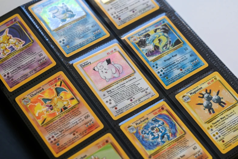 several pokemon trading cards are in a pile