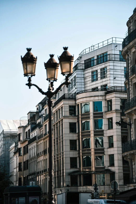 a lamp post in the middle of a city street