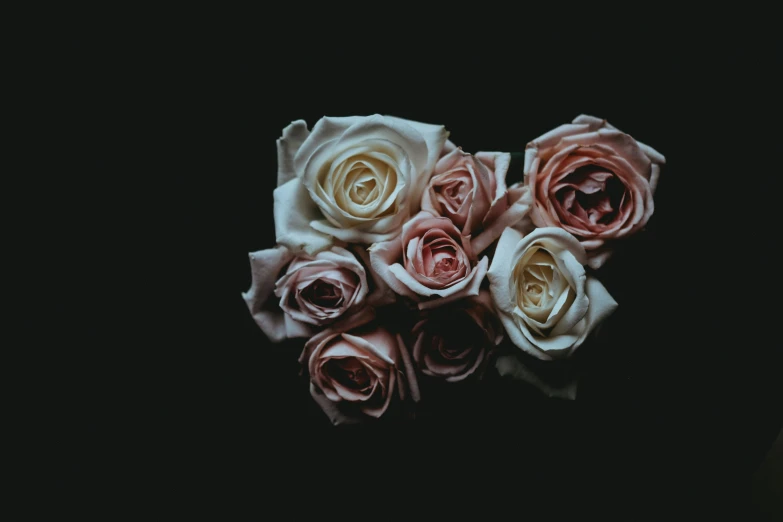 multiple colored flowers are arranged together in a bouquet