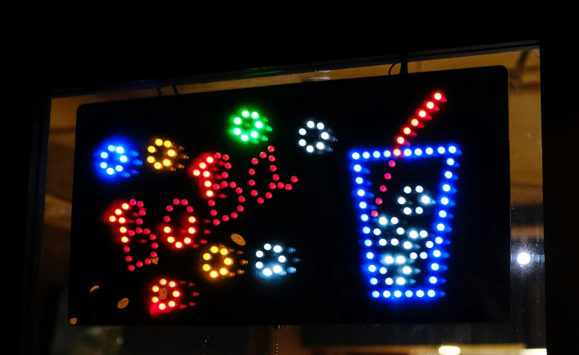 a lighted sign with lights in the shape of mario and luigi