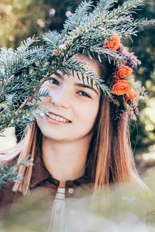 the woman is wearing flowers in her hair