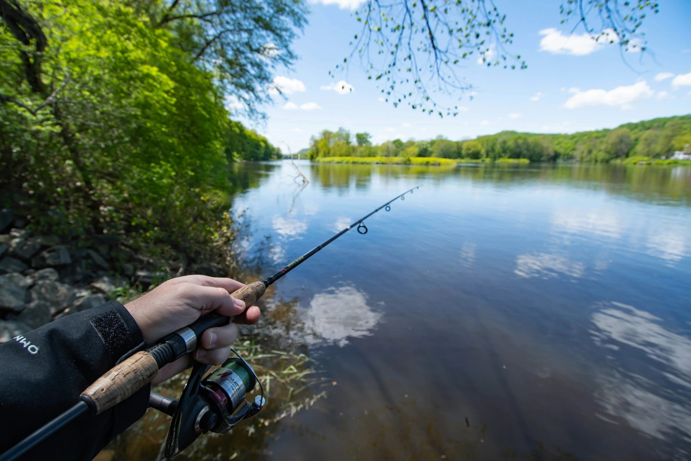 a man with some fishing rods is hooked to the boat