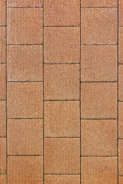 an orange and brown background with tiny squares