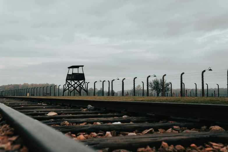 a clock tower on top of a train track