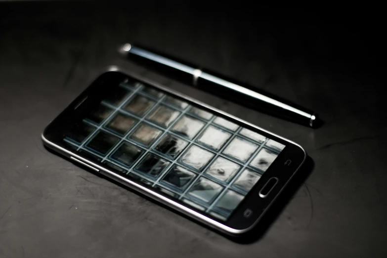 a smart phone that has a grid design on the screen