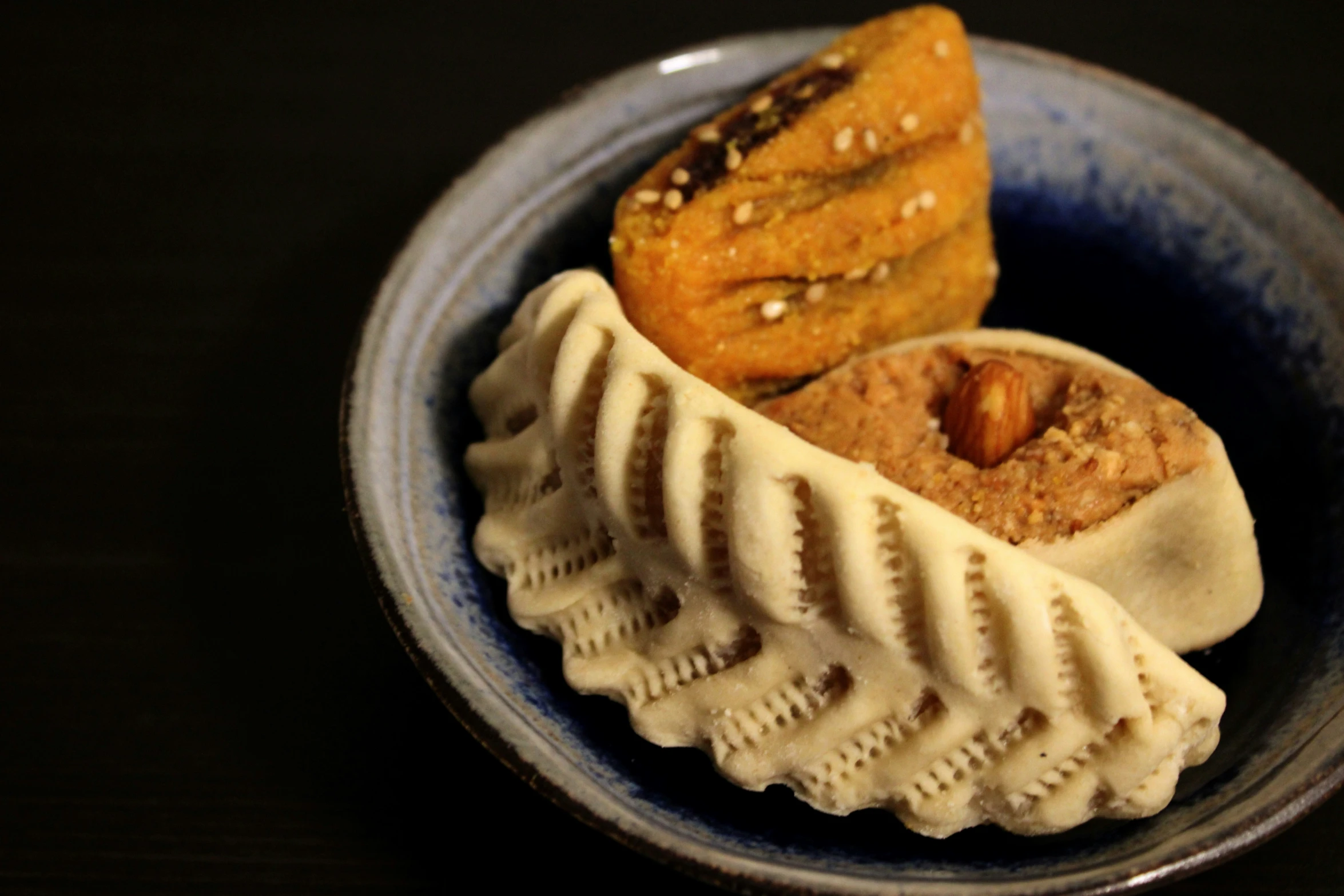 two desserts with different toppings sit in a bowl