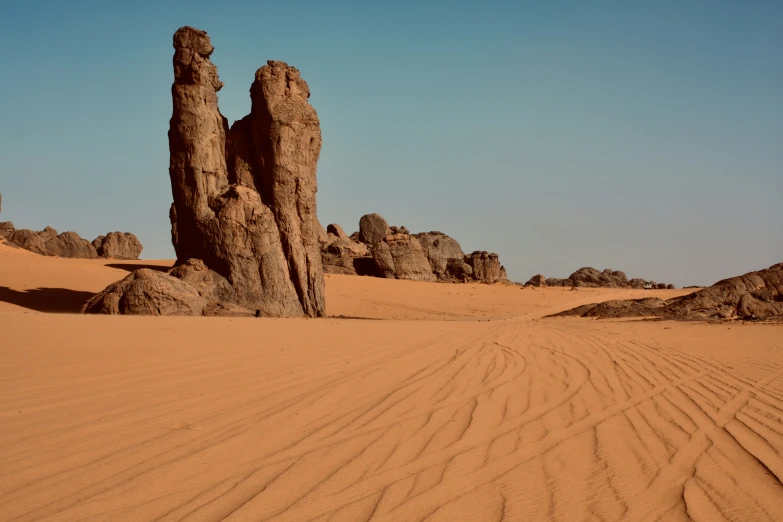 the desert is completely barren and filled with rock formations