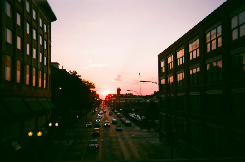 a street that has many cars going down it