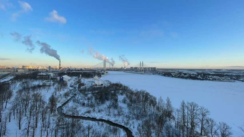 a large industrial city on a frozen river