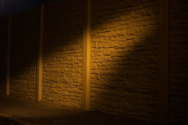 a sidewalk that has lights on the side