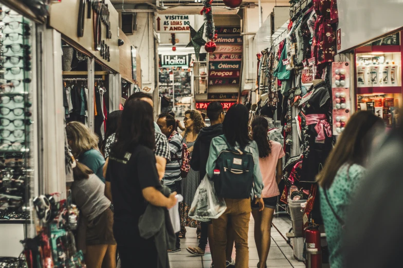 a couple of people that are walking in a store