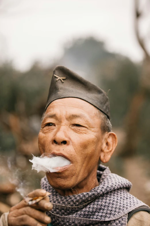 a man with an uncut cotton blade in his mouth