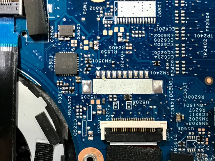 the bottom part of a computer motherboard with various components displayed