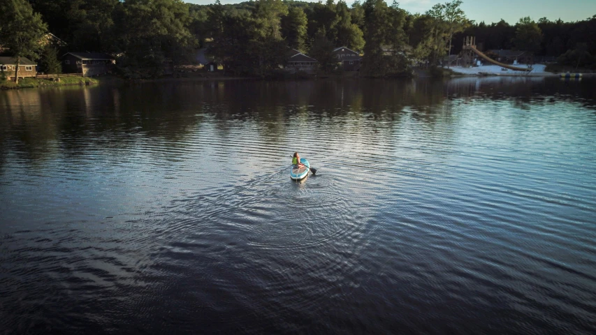 a person on a water ski alone in the middle of the lake