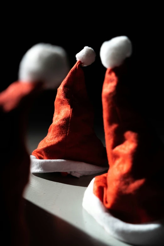 a red hat with two white snowflakes on it