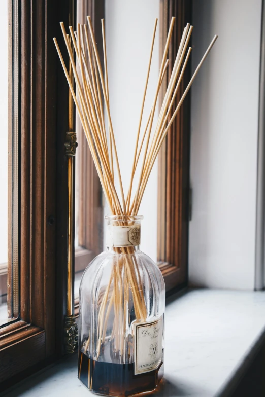 a vase with some brown sticks in it