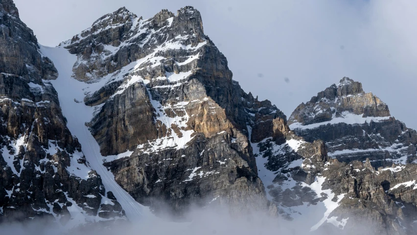 the tall snow capped mountains look like they are going to fall