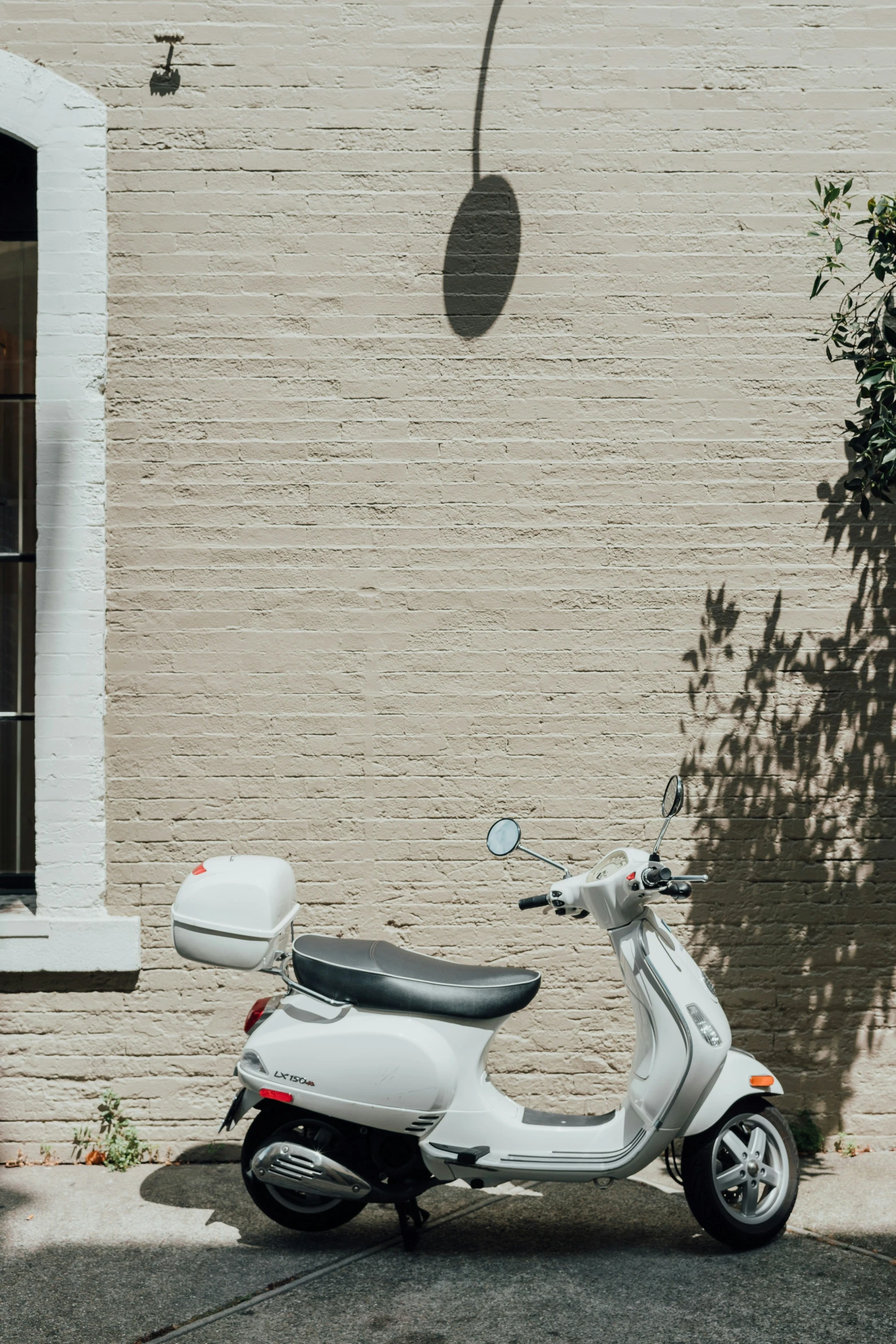 a scooter parked in front of a building