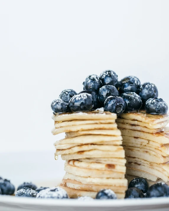 stack of pancakes with blueberries stacked on each other