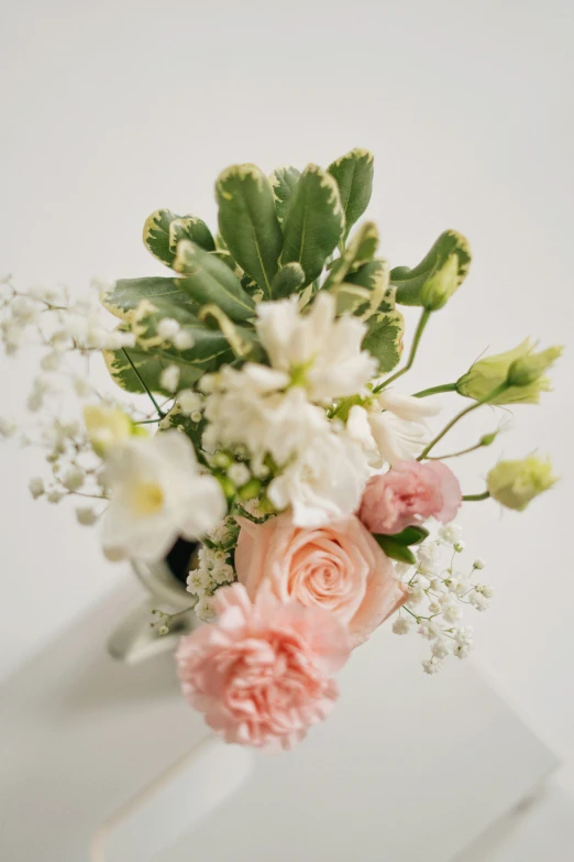 a bunch of flowers on a white table