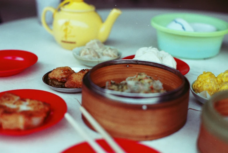 various bowls and plates are on the table