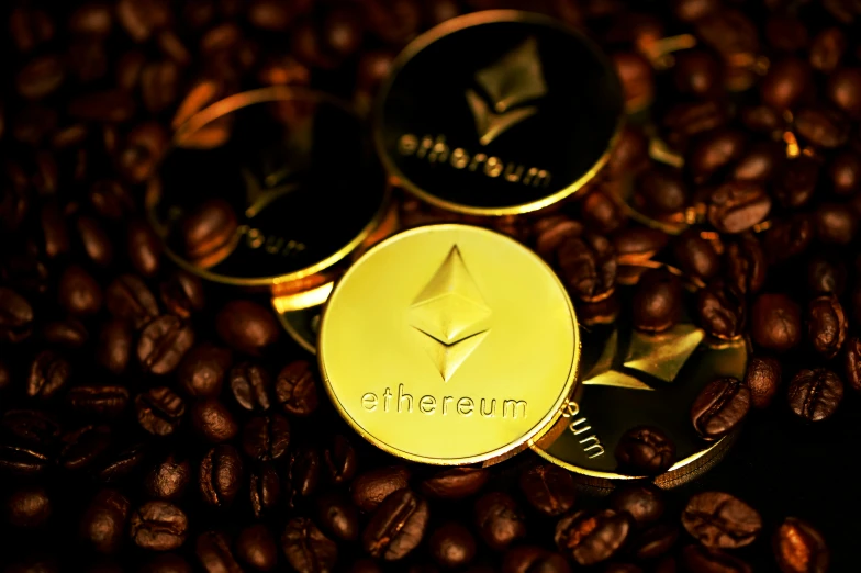 golden coffee beans with an image of a bin filled with gold