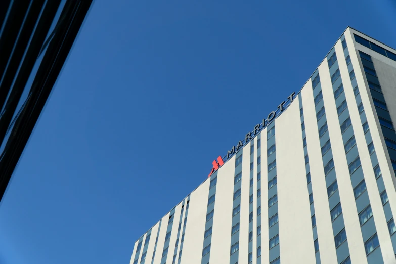 an office building with the top red on