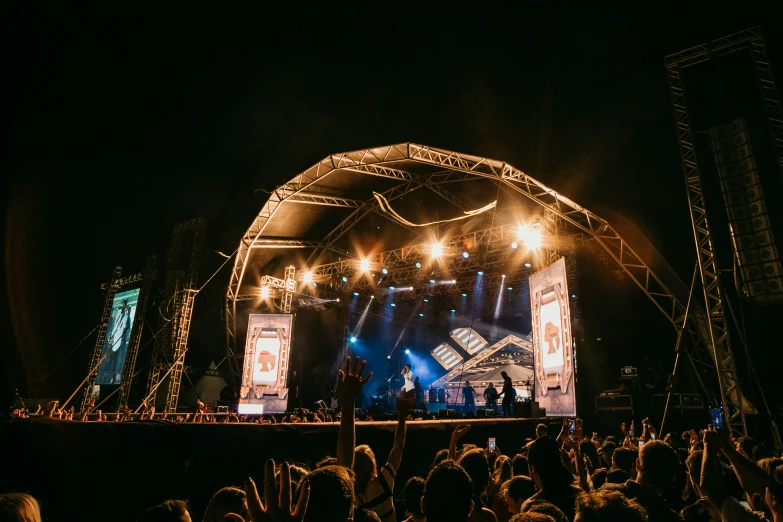 a group of people on stage at night