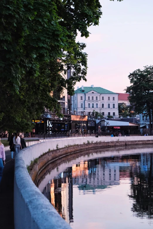 the view of people walking down the river