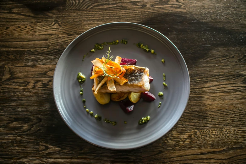 a white plate topped with vegetables and other food