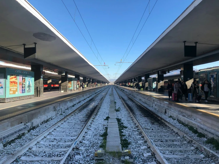 a train station is covered in snow and tracks