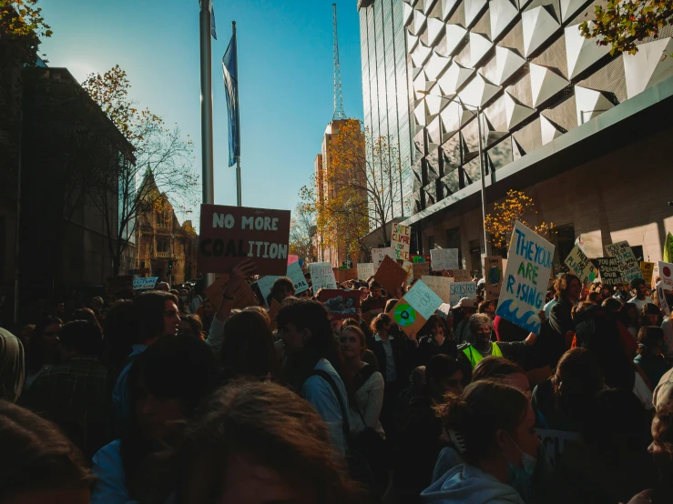 people are on a city street during a protest