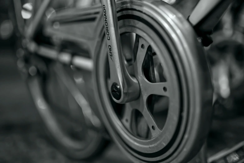 a close up of a bike's front wheel and spokes