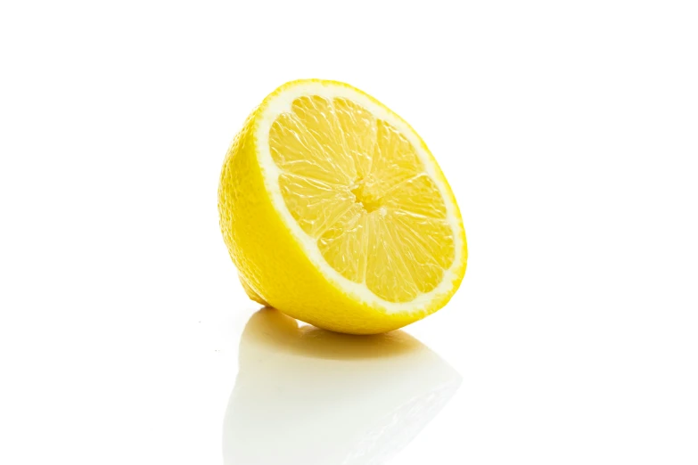 an image of lemon fruit that is half sliced