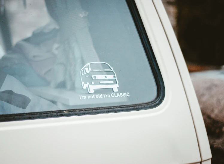 a bus with a woman looking through her window