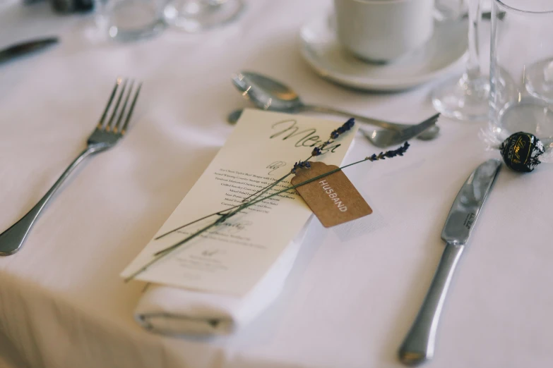 a table is set up with silverware and utensils