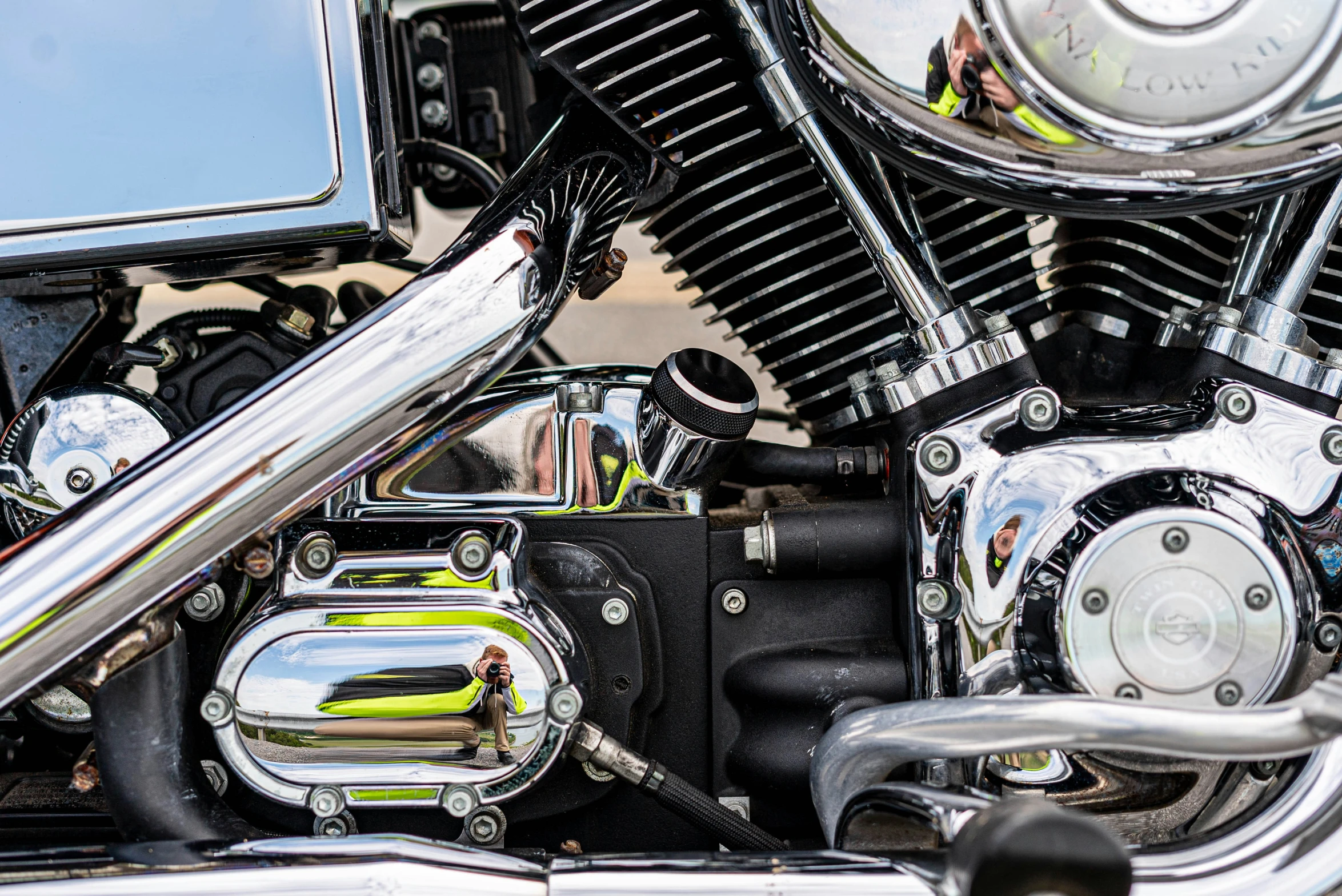 the chrome engine of a motorcycle is shiny