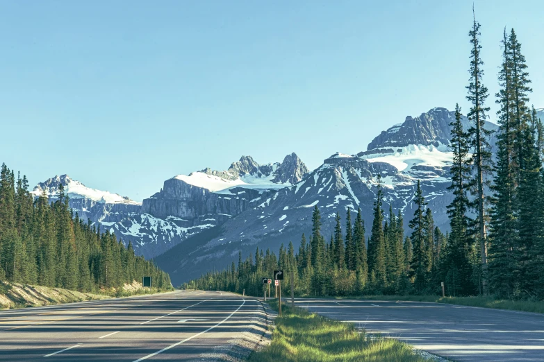 a person on the road near a mountain