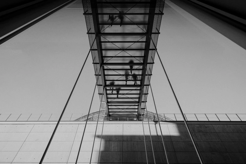 a tower structure with a shadow on the ground