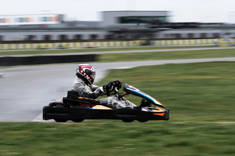 the man is racing an all terrain buggy on the track