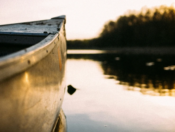 a boat is parked at the dock next to the water