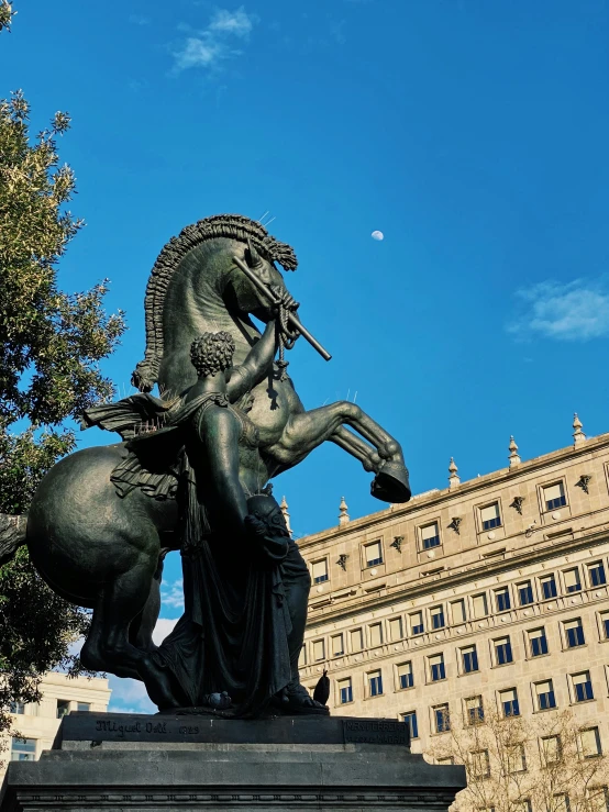 a statue of a woman riding a horse