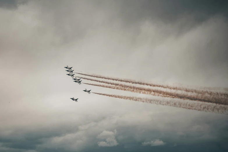 a bunch of jets flying in the sky