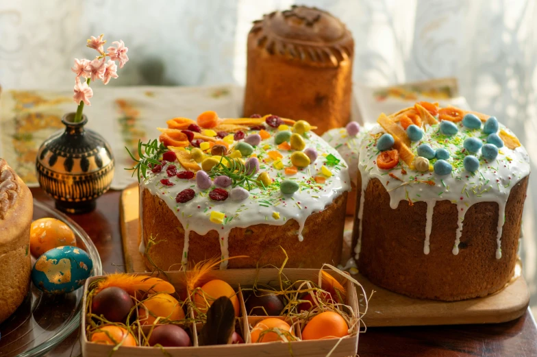 several cakes and decorations are on a table