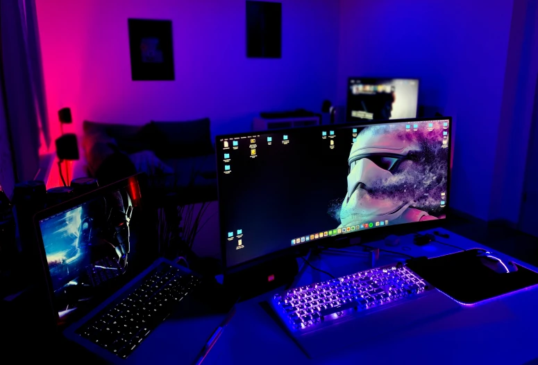 a desk is decorated with three computer monitors