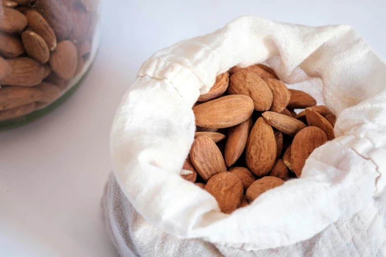 a bowl with a mixture of almonds in it