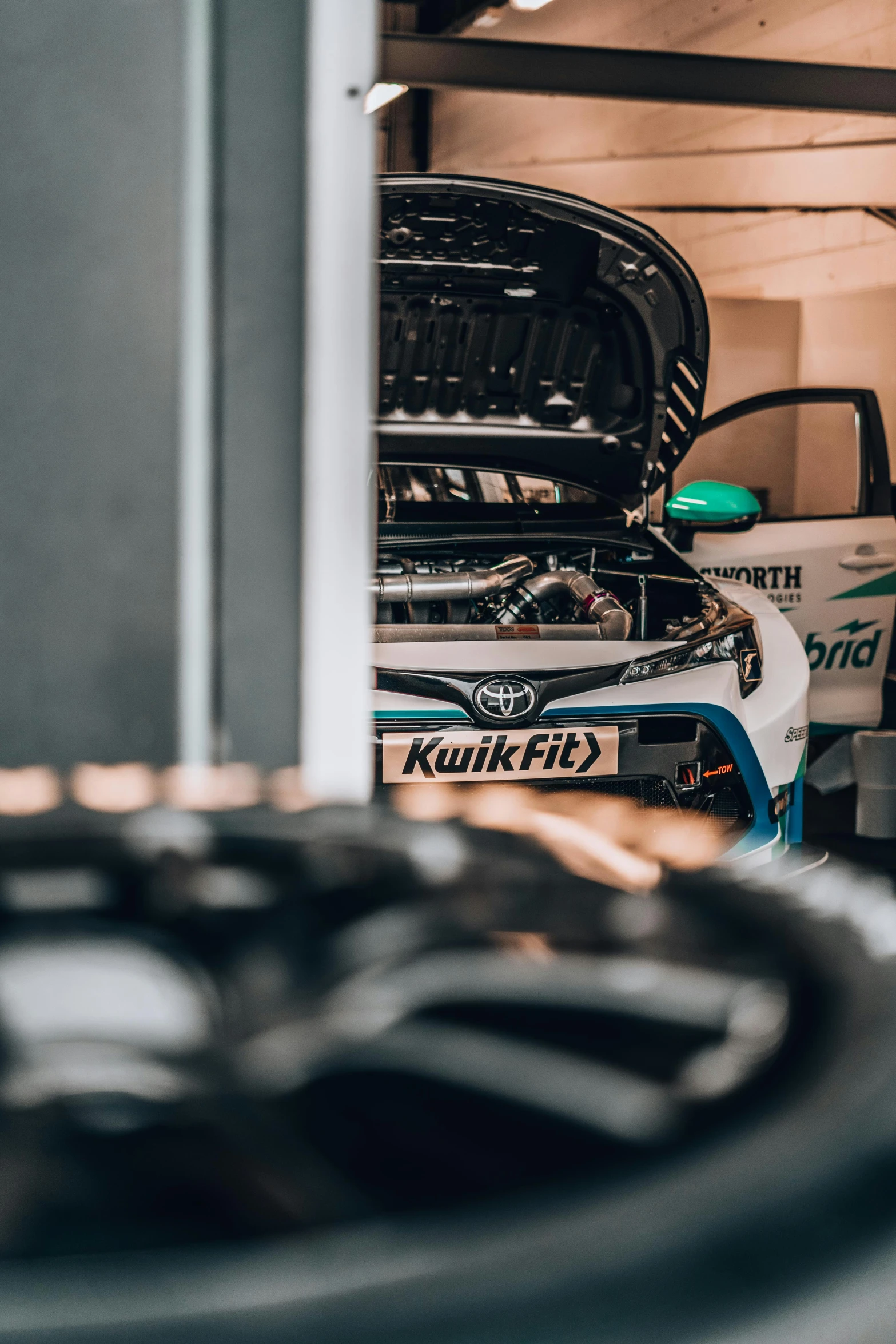 an image of the engine compartment of a car in a garage