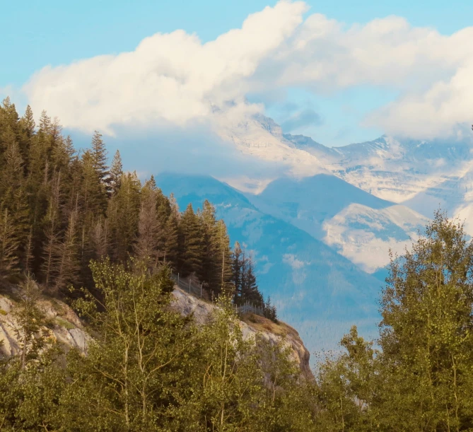 an image of snow capped mountain peaks in the distance