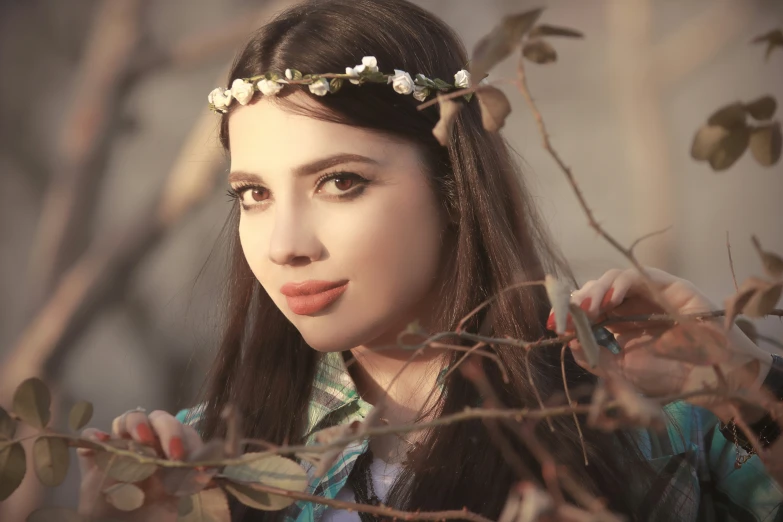 the girl with long hair is posing for a picture