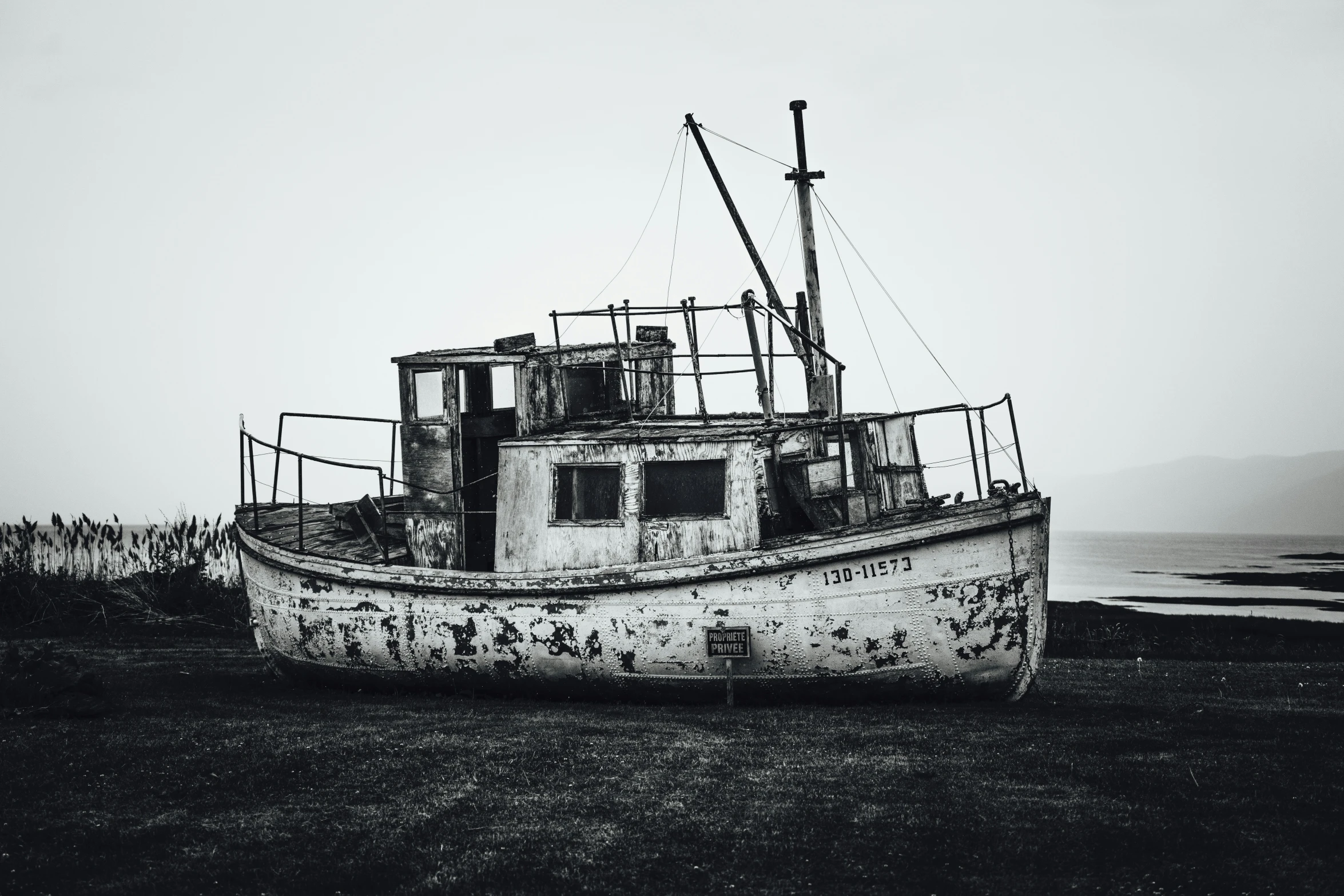 the old boat has faded paint on it's side